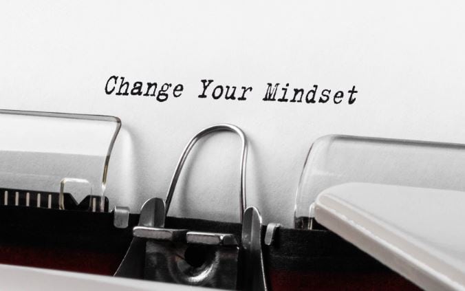 A page with the words "Change Your Mindset" written in a typewriter.